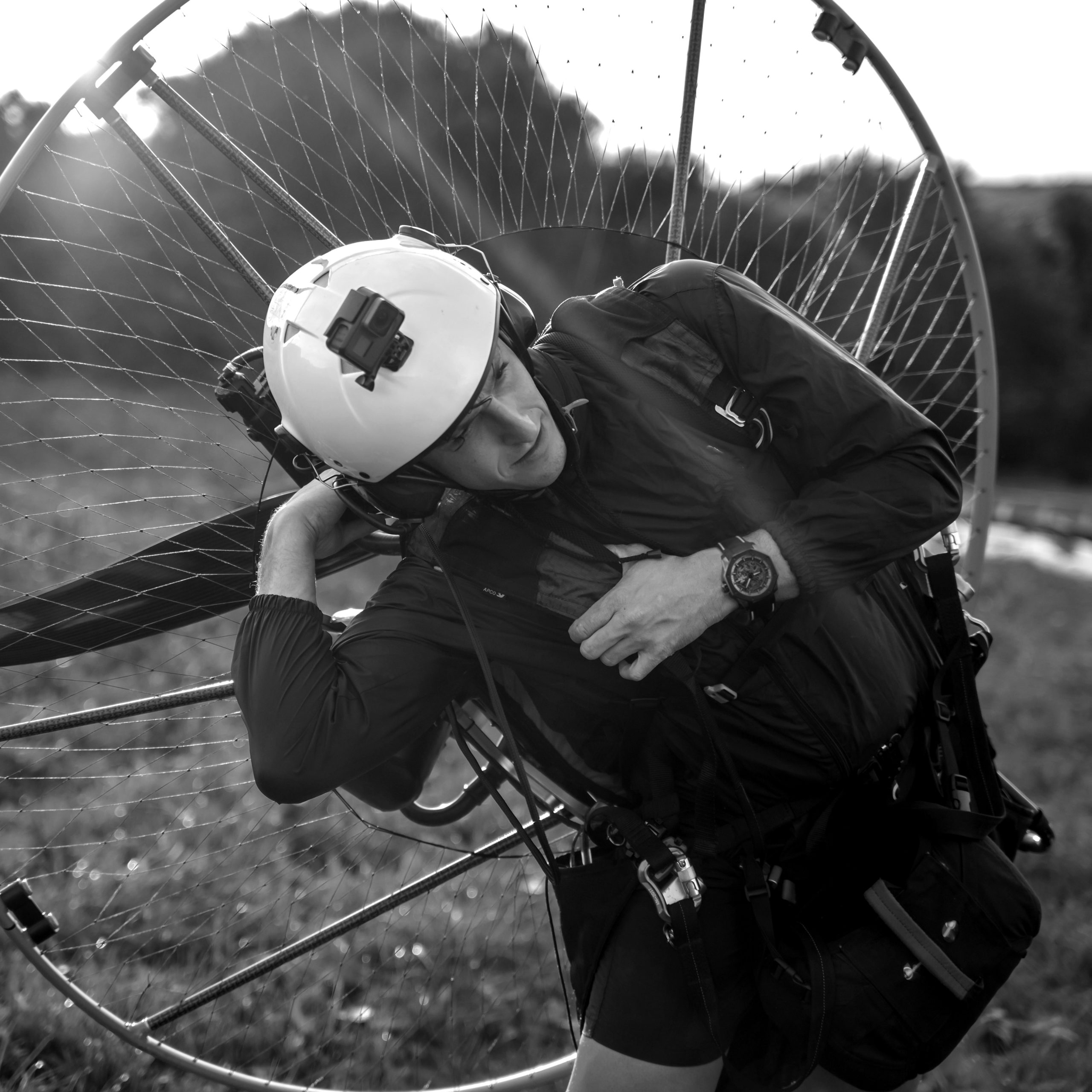 Young man, with the Powered Paragliding engine in his shoulders,